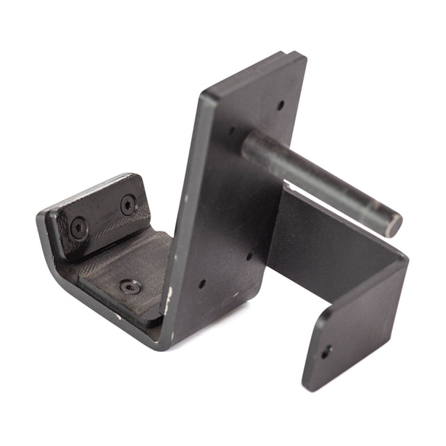 The Standard J-Cups from Bells of Steel are secured with a black, L-shaped bracket featuring a cylindrical protrusion on one side and multiple screw holes for easy mounting on your power rack. Made of metal or a sturdy material, this bracket is ideal for affixing the J-Cups securely.