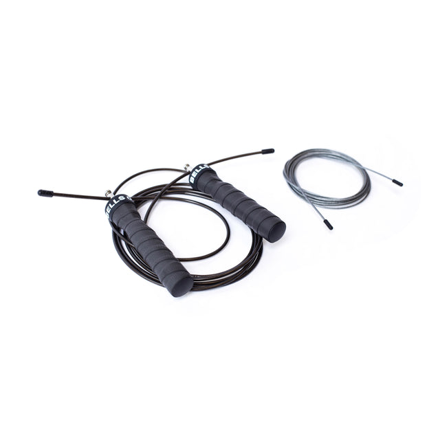 A black and gray adjustable jump rope from Bells of Steel with ergonomic handles is displayed on a white surface. The black rope, suited for cardio, features thick handles and a tight coil, while the gray version has thin handles with a looser coil.