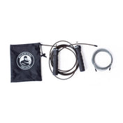 The Bells of Steel Jump Rope set, ideal for cardio training, comes with a carrying pouch featuring a white circular logo, and includes both a coiled adjustable rope and another with ergonomic black handles labeled "BELLS OF STEEL.