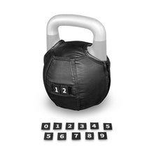 A Bells of Steel Kettlebell Wrap in black, featuring a prominent “12” label, adds floor protection to the kettlebell. Arranged below it are individual black number tiles—from 0 to 9—plus extra 1, 2, 3, 4, and 5 tiles in two tidy rows.