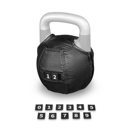 A Bells of Steel Kettlebell Wrap in black, featuring a prominent “12” label, adds floor protection to the kettlebell. Arranged below it are individual black number tiles—from 0 to 9—plus extra 1, 2, 3, 4, and 5 tiles in two tidy rows.