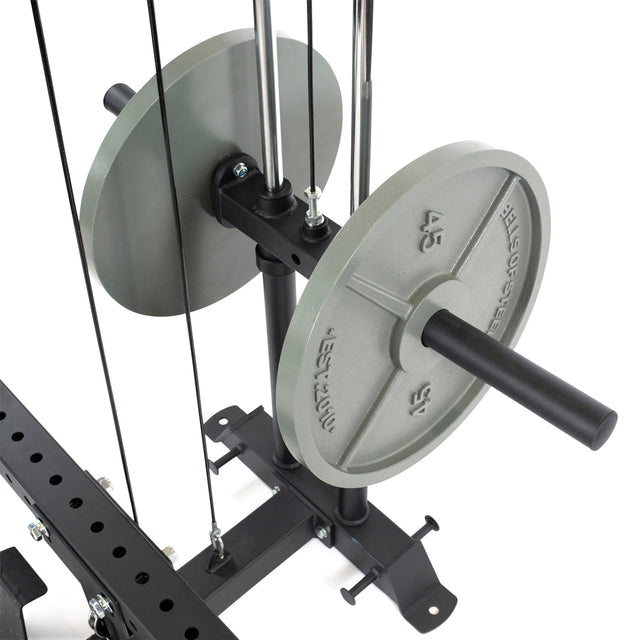 Close-up of a Bells of Steel gym system featuring the Lat Pulldown & Low Row Rack Attachment - Hydra & Manticore, with two 45-pound Olympic plates on a black rack. Metal rods and cables hint at its use for exercises such as lat pulldowns.