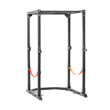 The Bells of Steel Light Commercial Power Rack (2.3" x 2.3", ⅝" holes) is a black steel, freestanding rack with adjustable holes and orange safety straps, ideal for weightlifting and strength training at home or in light commercial gyms.