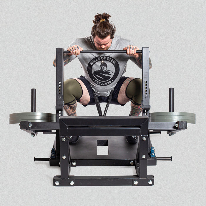 male model using belt squat machine