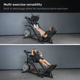 Two people use the Bells of Steel Leg Press Hack Squat Machine: a woman adds resistance bands for leg presses, while a man does calf raises. Text above says, "Multi-exercise versatility for your home gym.