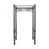 A great addition to any home gym, the Manticore Four Post Power Rack Builder features a grey metal frame with numerous 1-inch holes for versatile adjustments. The top beam proudly displays the "Bells of Steel" brand name. It's specifically designed for strength training exercises and supports a variety of modular components.