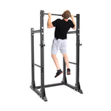 Picture of a Male model performing chin ups on the Manticore Half Rack PREBUILT