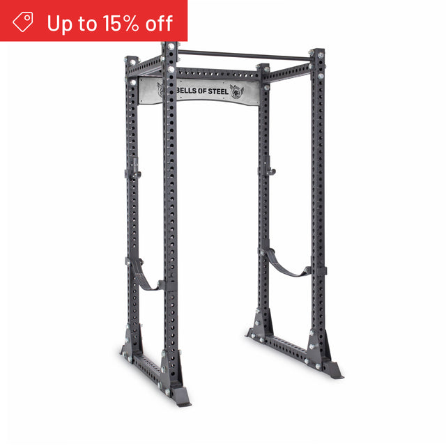 A Bells of Steel Manticore Flat Foot Power Rack Builder (3" x 3", 1" Holes) stands on a white background. A red banner in the top left corner reads “Up to 15% off.”.