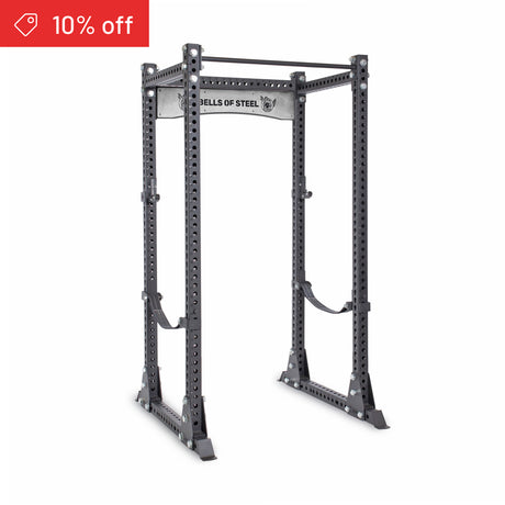 The Bells of Steel Manticore Flat Foot Power Rack Builder (3" x 3", 1" holes) stands sturdy on a white background, ideal for home gyms, with adjustable attachment holes and pull-up bar. A red "10% off" banner is in the top left corner.