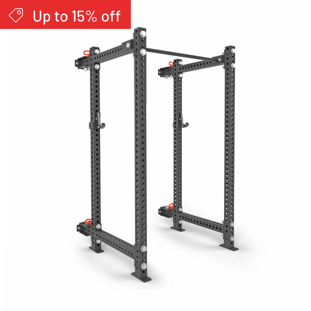 The Bells of Steel Manticore Folding Power Rack Builder (3" x 3", 1" Holes) stands on a white background, ideal for home gyms. A red banner in the top left corner announces "Up to 15% off.