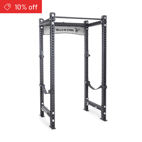 The Bells of Steel Manticore Four Post Power Rack Builder (3" x 3", 1" holes) is shown in gray steel on a white background, with a red "10% off" banner—making it ideal for any home gym.