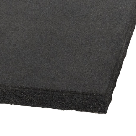 Close-up of a Bells of Steel Deadlift Platform Rubber Tile with a textured black surface, shown at an angle on a white background to highlight its durable layers and edges.