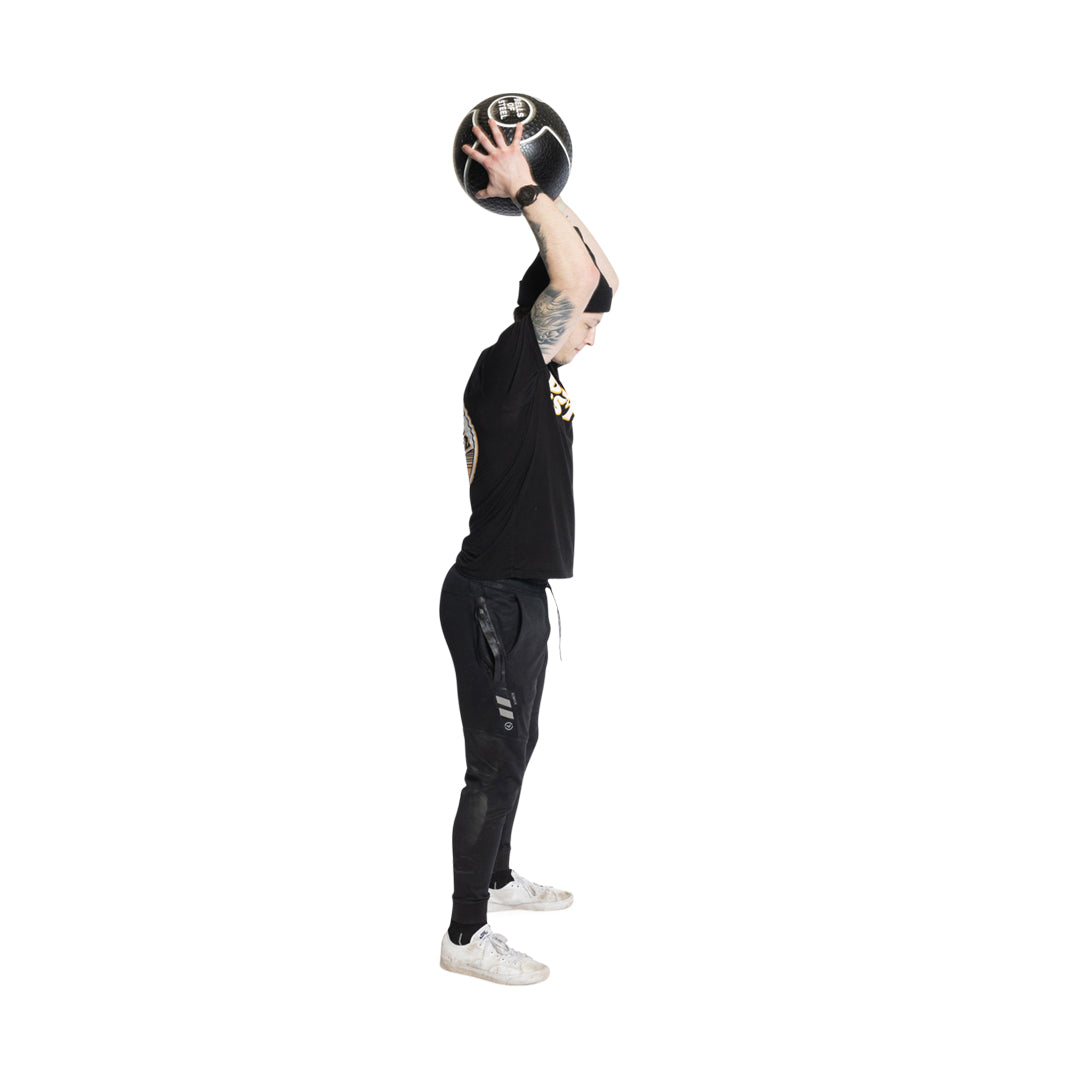 Male athlete holding Mighty Grip Medicine Ball