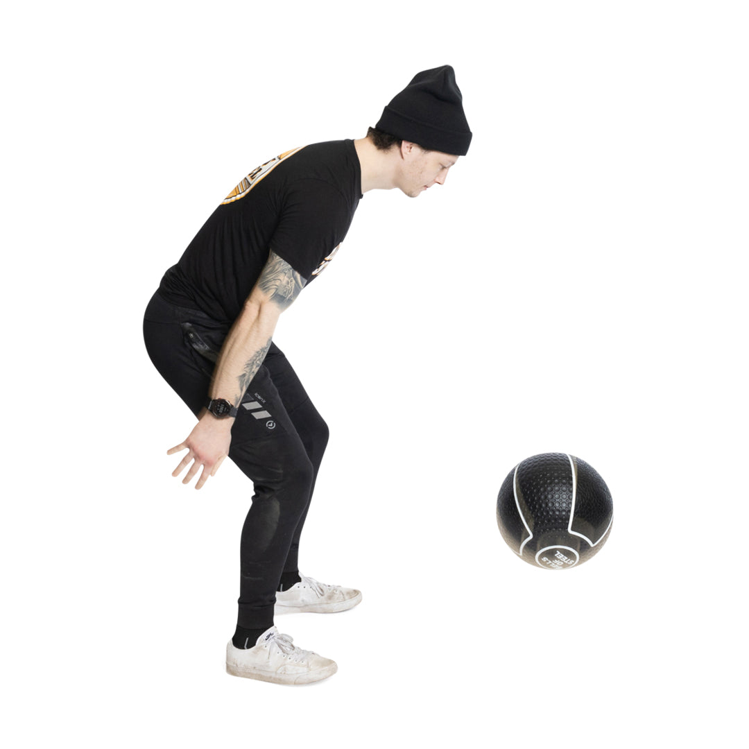 Male athlete throwing Mighty Grip Medicine Ball
