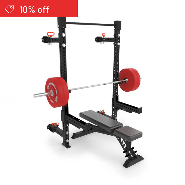 The Bells of Steel Manticore Folding Half Rack Builder (3" x 3", 1" Holes) features a loaded barbell with red plates on its sturdy frame. A red "10% off" banner appears in the corner—perfect for upgrading your home gym rack setup.