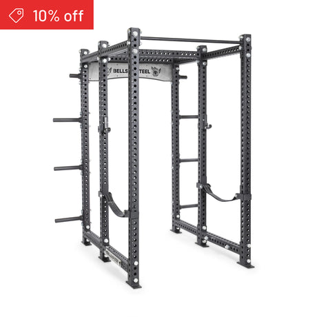 The Bells of Steel Manticore Six Post Power Rack Builder features 3" x 3" uprights, 1" holes for attachments, plate storage pegs, safety straps, and pull-up bars. A red banner in the top left shows "10% off.
