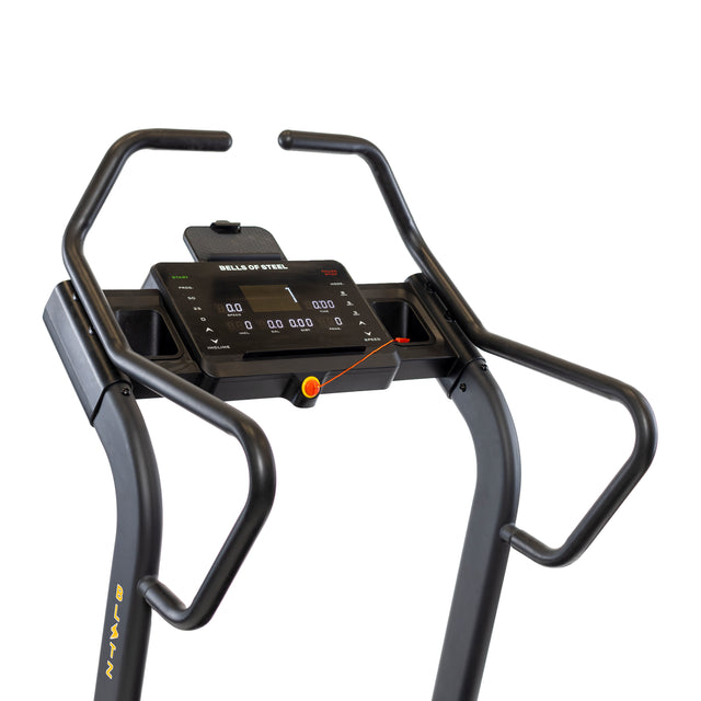 The Blitz Mountain Climber Treadmill by Bells of Steel shows a close-up console with digital speed, distance, and calorie displays. Features include a mobile holder, FTMS Bluetooth connectivity, sturdy handlebars, and an emergency stop cord with a red clip below the display.