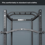 A black pull-up bar is mounted inside a Bells of Steel power rack, with text above stating, "Fits comfortably in standard rack widths." The Arch Nemesis Swiss Bar and cable attachments add versatility.