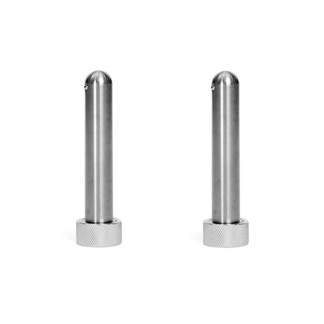 Two identical Magnetic Rack Attachment Pins by Bells of Steel, featuring cylindrical metal bodies with rounded tops and textured bases, stand upright on a plain white background, resembling sturdy mag pins designed as versatile power rack attachments.
