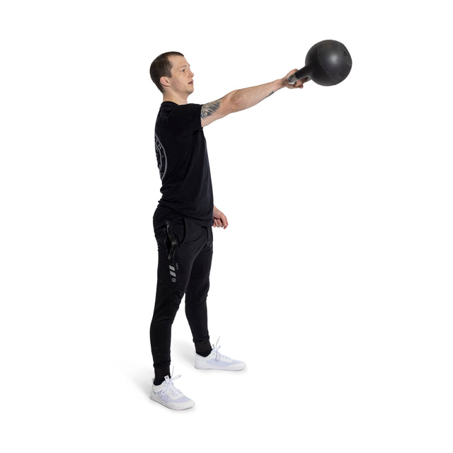 A person in black athletic wear performs a single-arm swing using the Plastic Bottom for Adjustable Kettlebell from Bells of Steel, extending an arm forward against a plain white background.