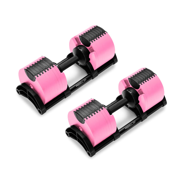 A pair of Nuobell's NÜOBELL Adjustable Dumbbells, with pink and black accents, is displayed on a white background. These dumbbells have a modern, patent-pending design with a slide mechanism and machined steel weight plates for seamless adjustment.