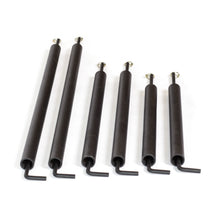 Six black Bells of Steel torsion springs of various lengths, each with a hook and a bent rod, are shown on a white background—perfect for adding protection to your power rack with Pin Pipe Safeties.
