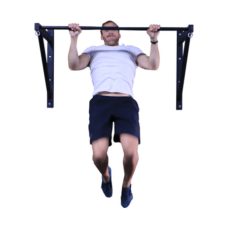 Male athlete doing pull-ups on an adjustable wall or ceiling mounted pull-up bar.