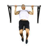 A person in a white t-shirt and black shorts performs a pull-up on a Bells of Steel Adjustable Wall or Ceiling Mounted Pull Up Bar against a white background.