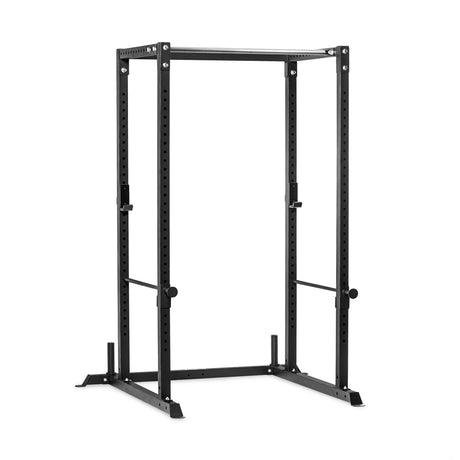 Bells of Steel Residential Power Rack (2.3″ x 2.3″, ⅝“ HOLES) in black steel, featuring vertical columns with holes for attachments, two barbell hooks, and two safety pins.