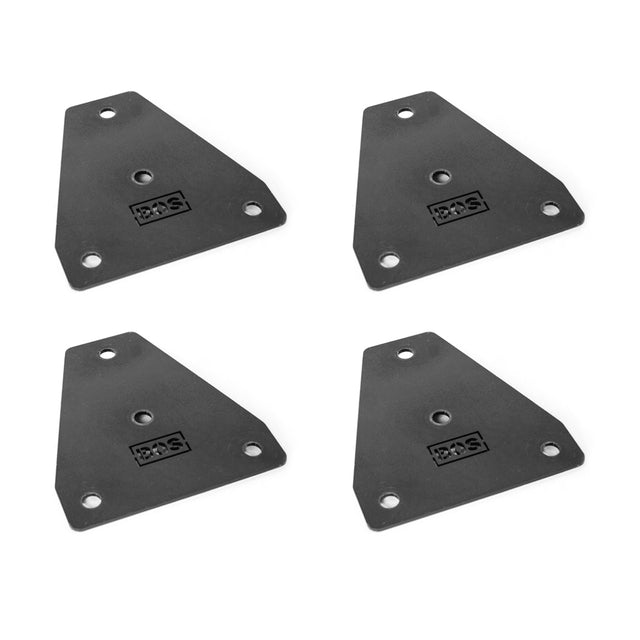 Four Hydra Flat Foot Components by Bells of Steel are symmetrically arranged on a white background. These black, triangular brackets with rounded corners and pre-drilled holes feature a central logo, designed for secure power racks and offering stability similar to a flat foot support system.