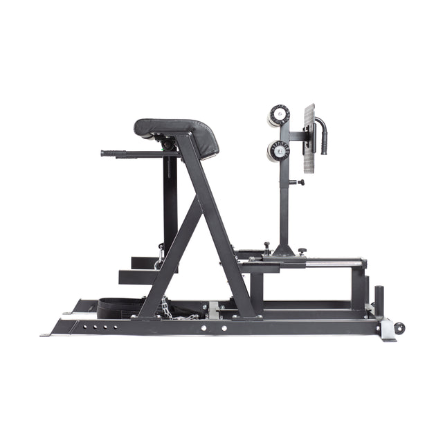 The Reverse Hammer 2 In 1 GHD and Reverse Back Extension by Bells of Steel is a black exercise machine displayed from the side. It showcases a padded seat, adjustable foot holders, and a robust metal frame. Ideal for focusing on the posterior chain, this equipment is presented against a plain white background.