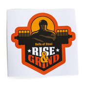 This sticker design from Bells of Steel showcases a muscular person lifting a barbell beneath an orange sun silhouette. Made with durable vinyl, the die-cut sticker is adorned with the bold phrase "Bells of Steel" at the top and "Rise & Grind" at the bottom, flanked by stars. The orange and black color scheme highlights both quality and style.