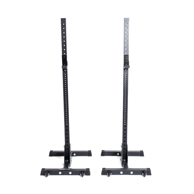 A pair of Bells of Steel Squat Stands, measuring 2.3" x 2.3", featuring ⅝" holes for height adjustment, shown against a plain white background. The design includes sturdy bases and supportive arms, ideal for weightlifting exercises.