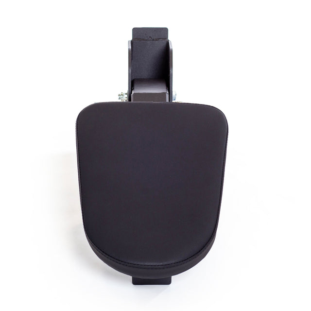 The Bells of Steel Seal Row Pad Rack Attachment is a black, rectangular armrest with rounded edges, shown from above on a white background—its shape resembling a chest support or seal row pad for fitness power racks.