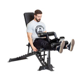 Male athlete doing seated leg curl using Leg Extension / Leg Curl Bench Attachment