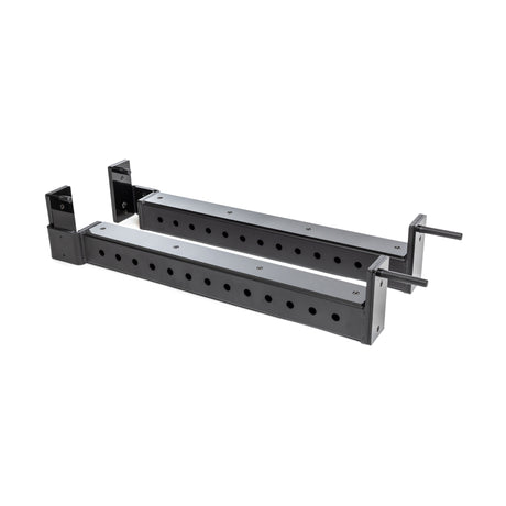 The Bells of Steel Flip-Down Safeties are two black metal adjustable brackets with multiple mounting holes, designed for power rack training safety and equipment support, shown on a white background.