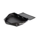 A sleek black rectangular bag of 600 Denier Polyester, partially open with a side flap showing white text. Spacious interior ideal for carrying items or storing your Bells of Steel Deadlift Pad - Replacement Cover for workouts.