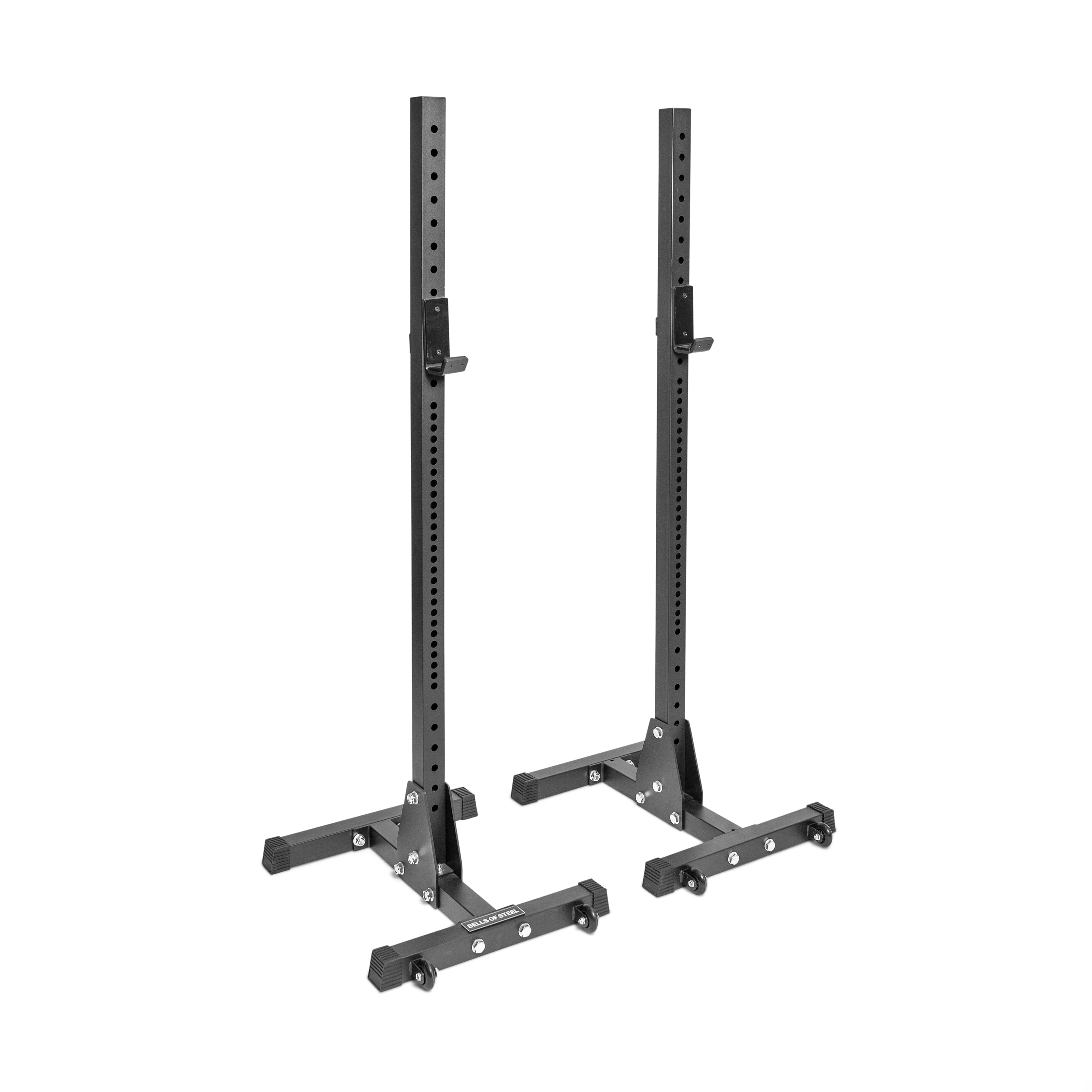 Introducing the Bells of Steel Squat Stands, designed with numerous ⅝" holes for height adjustments. These sturdy black stands come with convenient j-cups, robust bases, and support brackets, making them perfect for weightlifting and gym workouts.