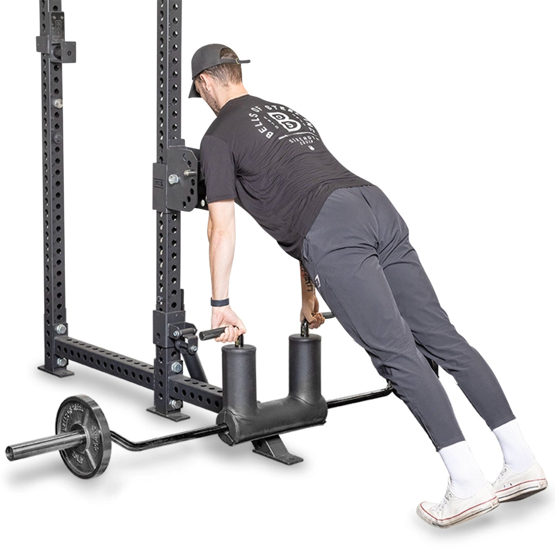 male athlete using the Safety Squat Bar Seal Row Handles for chest supported rows