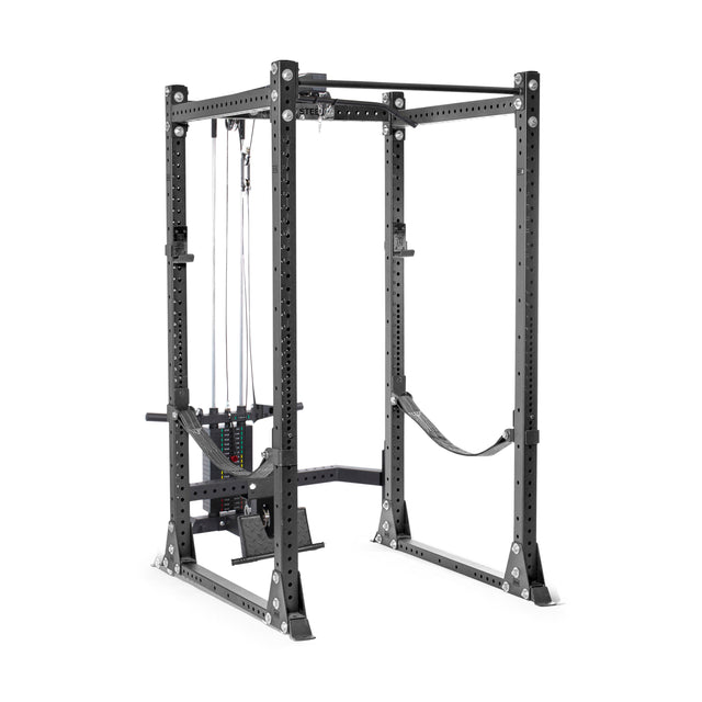 The Bells of Steel Lat Pulldown & Low Row Rack Attachment - Hydra & Manticore is a black power rack with adjustable safety bars and a cable pulley system for cable exercises. Designed for weightlifting, it offers multiple bar placements and supports Olympic weight plates.