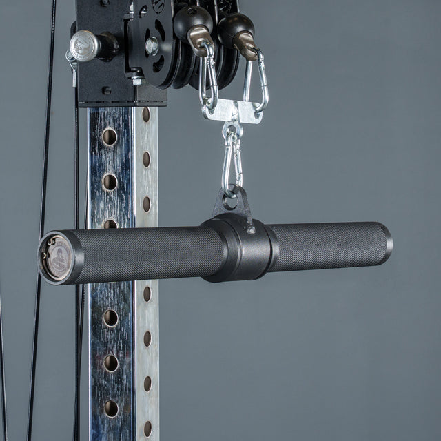 A close-up of the Bells of Steel Fat Bar - Straight Handle Bar attached to a cable machine for weightlifting, shown against a gray background.
