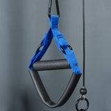 A close-up of a blue and black textured grip exercise handle from the Bells of Steel Rotational Pulley kit, hanging by a clip against a plain gray background.