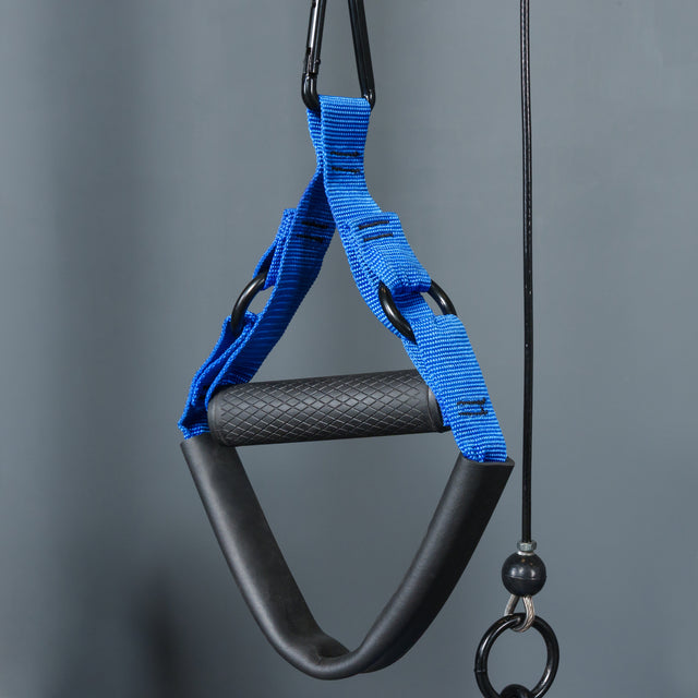 A close-up of a blue and black textured grip exercise handle from the Bells of Steel Rotational Pulley kit, hanging by a clip against a plain gray background.