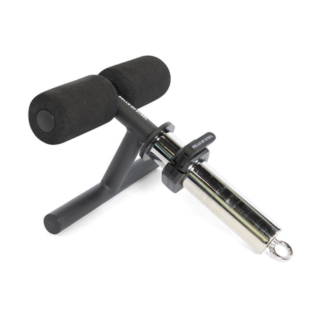 The Bells of Steel Tibialis Trainer Bar is a gym attachment with two black foam pads, a sturdy metal base, and a chrome sleeve with ring for Olympic plates—ideal for knee injury prevention and tibialis training.