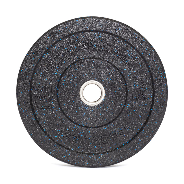 The Bells of Steel Crumb Bumper Plate features a textured black surface with blue speckles, a shiny stainless steel insert ring, and indented markings for durability during intense workouts.