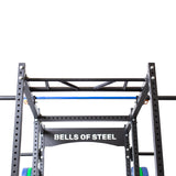 Gym equipment: Barbell holder in power rack setup.
