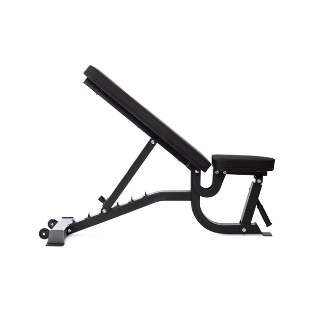 Side view of the Bells of Steel Adjustable Utility Bench featuring a black padded seat and backrest. Its black frame provides various incline angles, with the backrest upright. The bench includes an adjustable seat and wheels for easy transport.