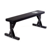 The Bells of Steel Flat Utility Bench is a chic exercise bench featuring a padded surface, durable metal legs, and the brand's logo on top. Ideal for strength training exercises, it provides robust support and is showcased against a plain white background. Perfect for enhancing workout efficiency.