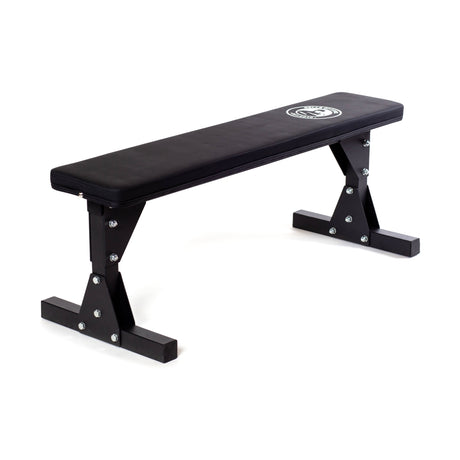The Bells of Steel Flat Utility Bench features a black padded surface and sturdy metal legs, perfect for weightlifting or workouts. Shown on a white background, it’s an ideal budget bench for any home gym setup.