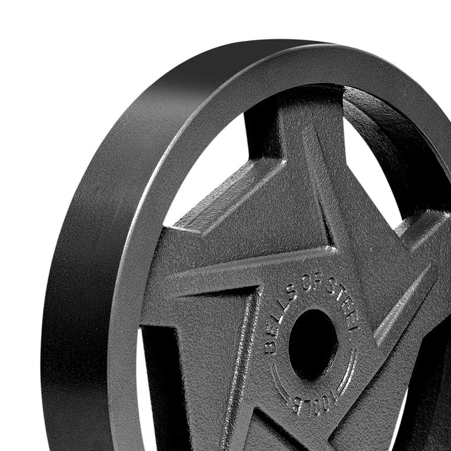 Close-up of a Black Mighty Grip Olympic Weight Plate by Bells of Steel, featuring a star-shaped design with the brand's name engraved. The plate has a smooth, matte finish and includes a central hole for bar mounting. Its ergonomic design and precision grip handles ensure optimal performance.